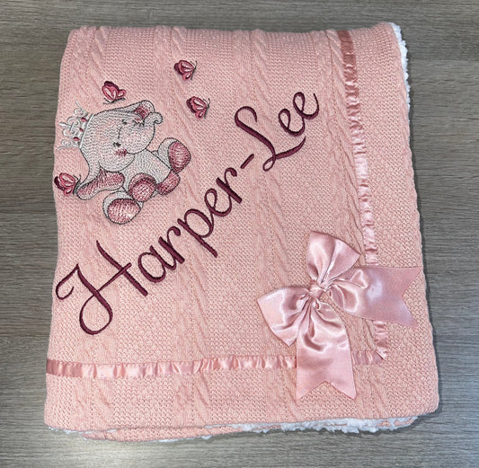 Beautiful personalised cable knit bow blanket with Ellie design