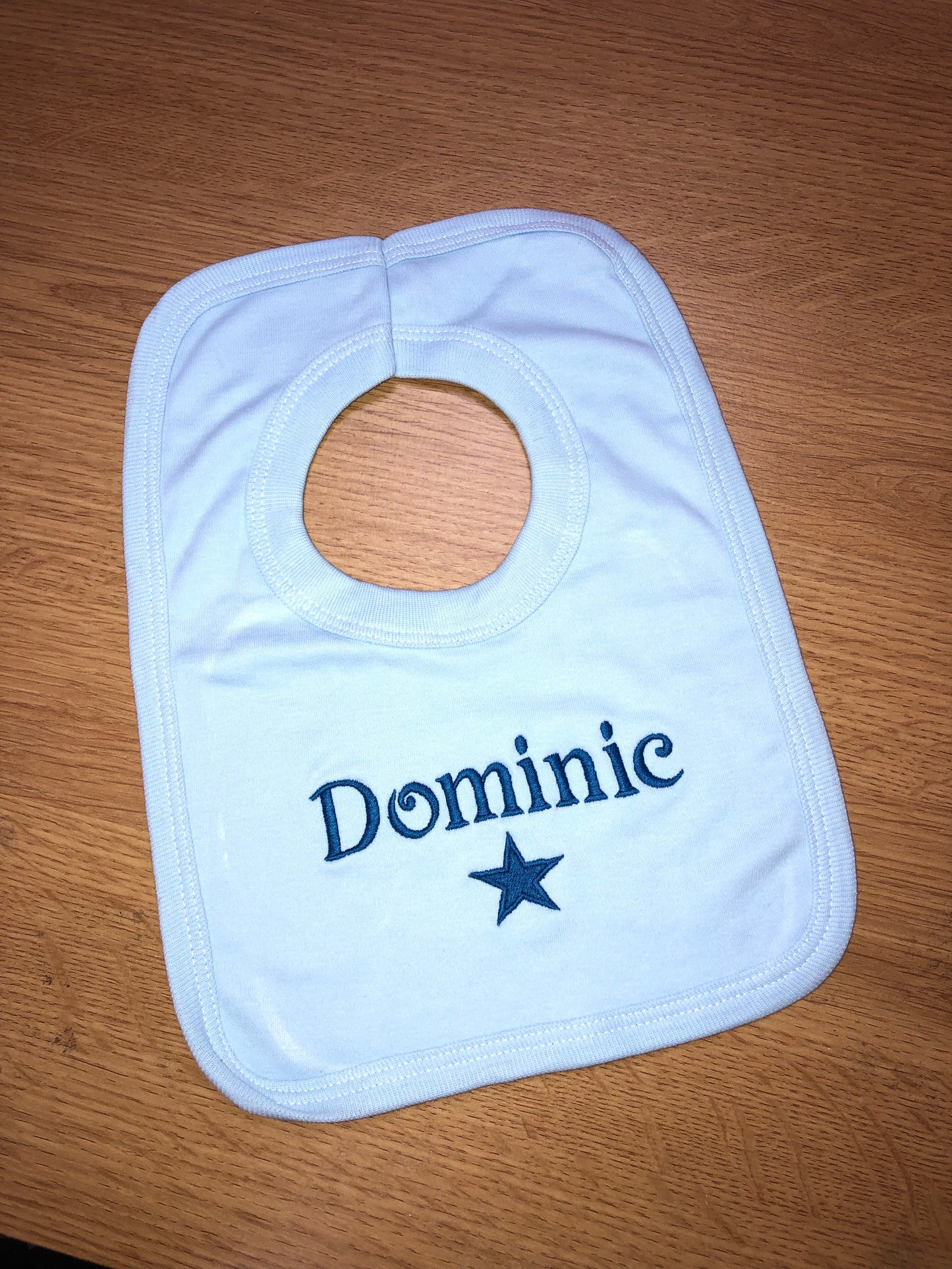 Personalised blue bib with 1st name & star